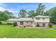 Back of home featuring patio area, brick facade and spacious backyard at 3947 Veracruz Ct, Decatur, GA 30034