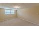Finished basement offers natural light and neutral carpet at 3947 Veracruz Ct, Decatur, GA 30034