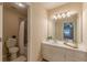 Bright bathroom featuring a shower-tub combination, a vanity, and a mirror at 3947 Veracruz Ct, Decatur, GA 30034