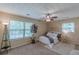 Comfortable bedroom with lots of natural light, a ceiling fan, and neutral décor at 3947 Veracruz Ct, Decatur, GA 30034