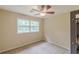 Bedroom with window for natural light and ceiling fan at 3947 Veracruz Ct, Decatur, GA 30034