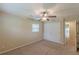 Comfortable bedroom features plush carpeting, ceiling fan, and ample closet space at 3947 Veracruz Ct, Decatur, GA 30034