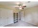 Bedroom with neutral carpet, closet, and ceiling fan at 3947 Veracruz Ct, Decatur, GA 30034