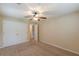 Spacious bedroom features plush carpeting, ceiling fan, and ample closet space at 3947 Veracruz Ct, Decatur, GA 30034