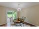 Bright dining room with a sliding glass door leading to the outdoor patio area at 3947 Veracruz Ct, Decatur, GA 30034