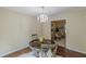 Elegant dining room with a decorative chandelier and a view into the living area at 3947 Veracruz Ct, Decatur, GA 30034
