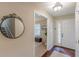 Inviting foyer with hardwood floors, decorative mirror, staircase and natural light at 3947 Veracruz Ct, Decatur, GA 30034