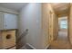 Hallway featuring access to basement stairs and bedroom at 3947 Veracruz Ct, Decatur, GA 30034