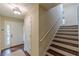 Foyer with white front door, staircase, hardwood floors and coat closet at 3947 Veracruz Ct, Decatur, GA 30034