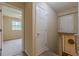 Hallway leading to bedroom with closet, and access to basement stairs at 3947 Veracruz Ct, Decatur, GA 30034