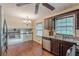 Spacious kitchen featuring hardwood floors, stainless steel appliances, and an adjacent dining area at 3947 Veracruz Ct, Decatur, GA 30034
