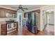 Modern kitchen features stainless steel appliances, wood cabinets, hardwood floors and a ceiling fan at 3947 Veracruz Ct, Decatur, GA 30034