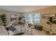 Cozy living room with large windows, neutral decor, and comfortable seating arrangement at 3947 Veracruz Ct, Decatur, GA 30034