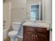 Bathroom featuring a vanity with dark wood cabinets and a sink with chrome hardware at 4938 Wewatta Sw St, Atlanta, GA 30331