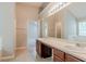 Bathroom featuring a large double sink vanity and a separate room with tub and shower at 4938 Wewatta Sw St, Atlanta, GA 30331