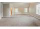 Spacious carpeted bedroom with a high ceiling and abundant natural light from multiple windows at 4938 Wewatta Sw St, Atlanta, GA 30331