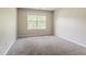 Bedroom featuring a window and neutral colored carpeting at 4938 Wewatta Sw St, Atlanta, GA 30331