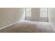 A bright bedroom with plush carpeting and two windows offering natural light at 4938 Wewatta Sw St, Atlanta, GA 30331