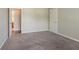 Bedroom featuring neutral walls, carpeting and a door leading to another room at 4938 Wewatta Sw St, Atlanta, GA 30331