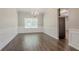 Formal dining room boasting wainscoting, hardwood floors, and chandelier at 4938 Wewatta Sw St, Atlanta, GA 30331