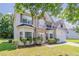 Front exterior of a two-story home with landscaped yard at 4938 Wewatta Sw St, Atlanta, GA 30331