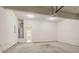 Empty two car garage with a water heater and access to the house at 4938 Wewatta Sw St, Atlanta, GA 30331