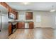 Kitchen featuring stainless steel appliances and wood floors at 4938 Wewatta Sw St, Atlanta, GA 30331