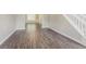 Open-concept living area with hardwood floors and staircase at 4938 Wewatta Sw St, Atlanta, GA 30331