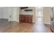 Living room featuring a bar nook and view of the home's entryway at 4938 Wewatta Sw St, Atlanta, GA 30331