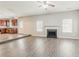 Bright living room featuring a fireplace and an open kitchen area at 4938 Wewatta Sw St, Atlanta, GA 30331