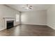 Living room featuring a fireplace, hardwood floors, and natural light at 4938 Wewatta Sw St, Atlanta, GA 30331