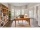 Bright home office features a bookcase and hardwood flooring at 4938 Wewatta Sw St, Atlanta, GA 30331
