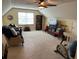 Open bonus room with a TV, sitting area, and exercise equipment at 750 Providence Dr, Lawrenceville, GA 30044