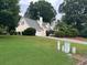 Beautiful single-Gathering home with a lush green lawn and a two-car garage at 750 Providence Dr, Lawrenceville, GA 30044