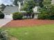 Charming single-Gathering home featuring a well-manicured lawn, mulched flower beds, and a two-car garage at 750 Providence Dr, Lawrenceville, GA 30044