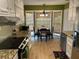 Eat-in kitchen boasting stainless appliances, modern lighting and lots of bright natural light at 750 Providence Dr, Lawrenceville, GA 30044