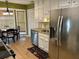 Eat-in kitchen boasting stainless appliances, modern lighting and lots of bright natural light at 750 Providence Dr, Lawrenceville, GA 30044