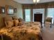 Bright main bedroom featuring large windows, carpet, and neutral wall color at 750 Providence Dr, Lawrenceville, GA 30044