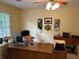 Bright office space with a wooden desk, computer, and natural light from a window at 750 Providence Dr, Lawrenceville, GA 30044