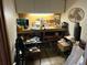 This workshop features ample counter space with upper and lower cabinets, as well as a cooling fan at 750 Providence Dr, Lawrenceville, GA 30044