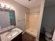 Bathroom featuring a walk-in shower, single sink vanity with granite countertop, and toilet at 1095 S Burnt Hickory Rd, Douglasville, GA 30134