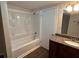 Updated bathroom featuring a shower/tub combo and a single sink vanity with a granite countertop at 1095 S Burnt Hickory Rd, Douglasville, GA 30134