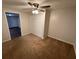 Cozy bedroom with plush carpeting, neutral walls, and a closet with double doors at 1095 S Burnt Hickory Rd, Douglasville, GA 30134