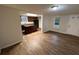 Open concept living area featuring wood flooring, neutral walls, and plenty of natural light at 1095 S Burnt Hickory Rd, Douglasville, GA 30134