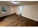 Comfortable living room with wood floors, neutral paint, and direct access to the entry door at 1095 S Burnt Hickory Rd, Douglasville, GA 30134