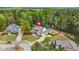 Expansive home featuring a private backyard swimming pool and well-manicured lawn surrounded by lush greenery at 229 Primstone Way, Mcdonough, GA 30253