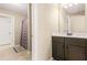 Bathroom including cabinet, mirror and adjacent bathroom and room entrances at 229 Primstone Way, Mcdonough, GA 30253