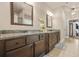 Spacious bathroom with double vanity, granite countertops, dark wood cabinets, and stylish decor at 229 Primstone Way, Mcdonough, GA 30253