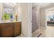 Cozy bathroom featuring a vanity with modern fixtures, a mirror, and access to a separate shower at 229 Primstone Way, Mcdonough, GA 30253
