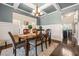 Bright dining room with coffered ceilings, wainscoting, chandelier, and hardwood floors at 229 Primstone Way, Mcdonough, GA 30253
